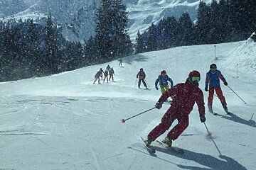 a ski instructor giving a group lesson
