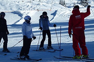 a ski instructor giving a group lesson