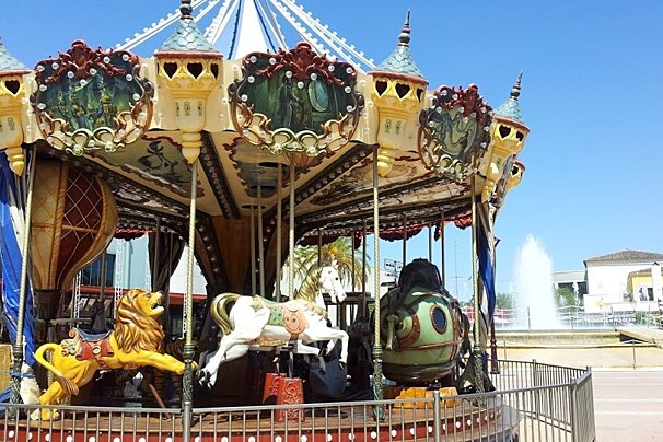 a carousel in a childrens play area