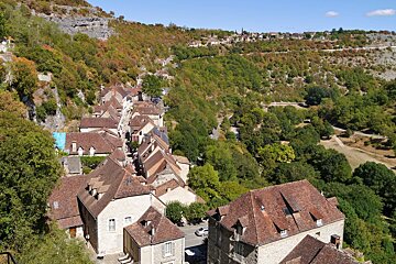 view of the town & over the valley & forest below