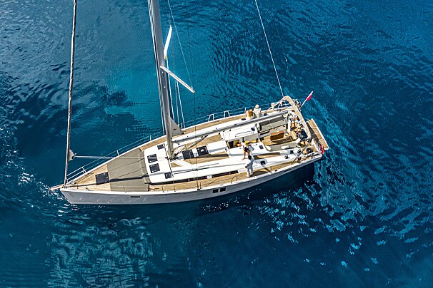 An aerial view of a sailboat in the ocean
