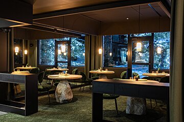 A restaurant with a lot of tables and chairs