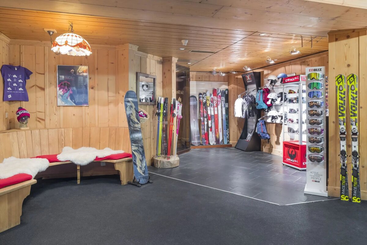 A display of skis and snowboards in a store