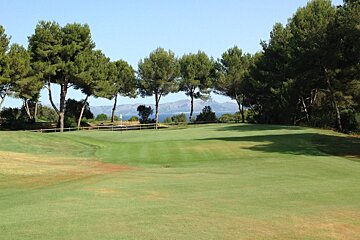 a golf course green at alcanada golf club
