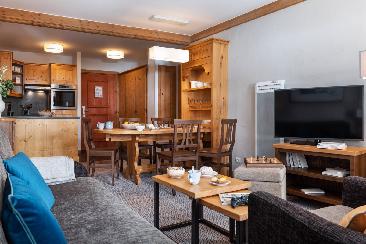 A living room with a couch and a flat screen tv