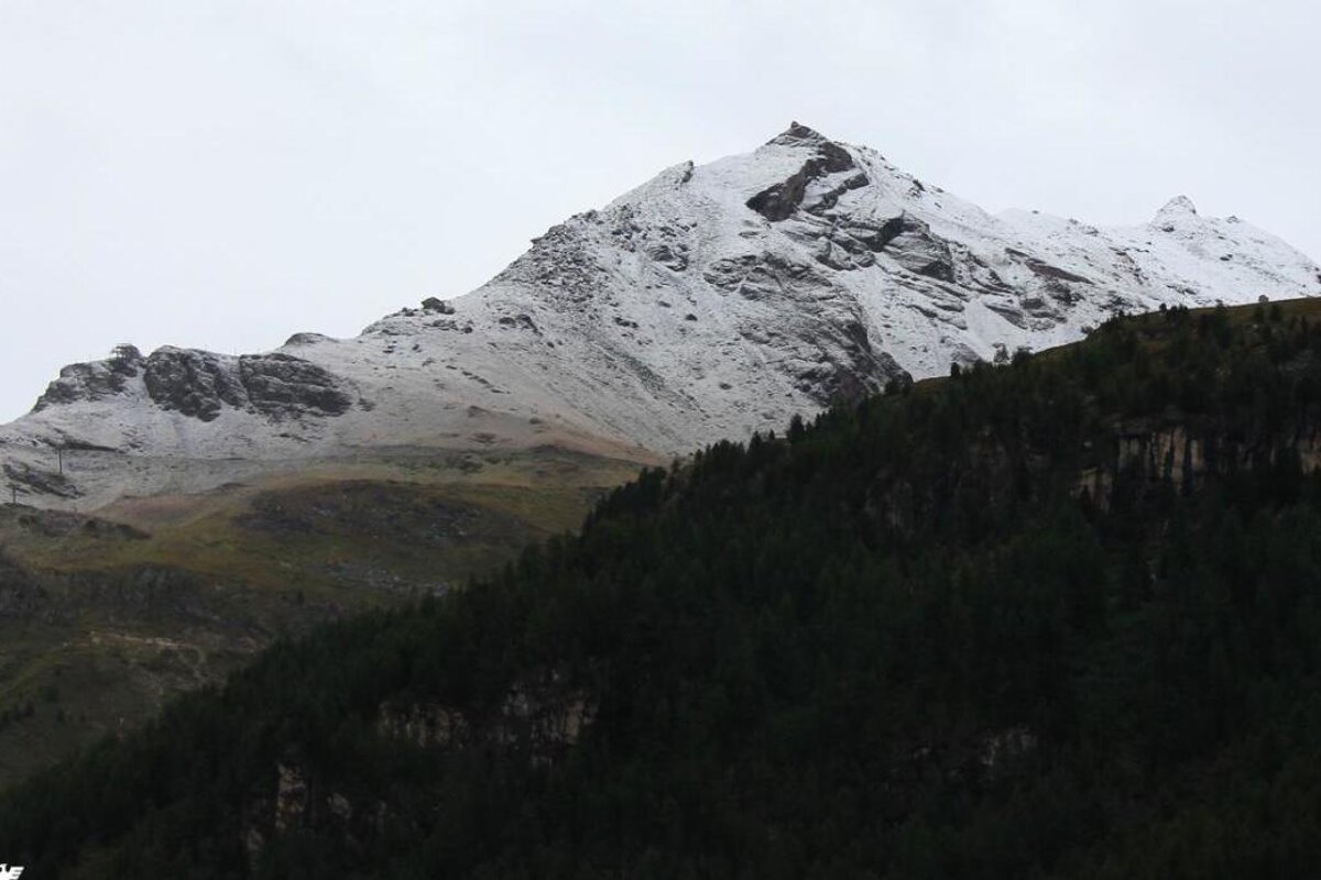 snowy mountain in september