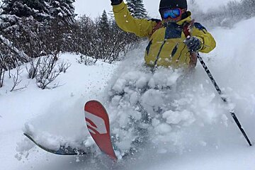 a man skiing in deep powder