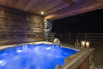 A hot tub with blue lights and a remote control