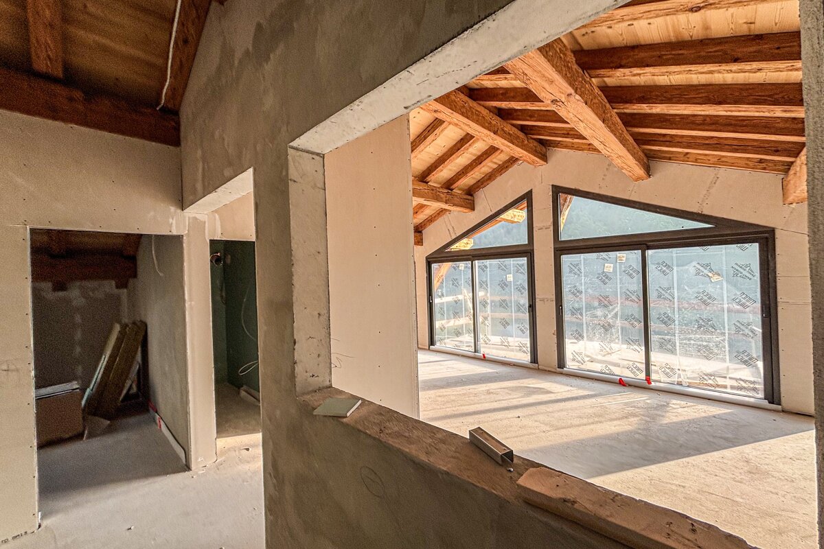 A room with a lot of windows and a roof