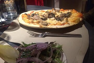 a pizza and side salad