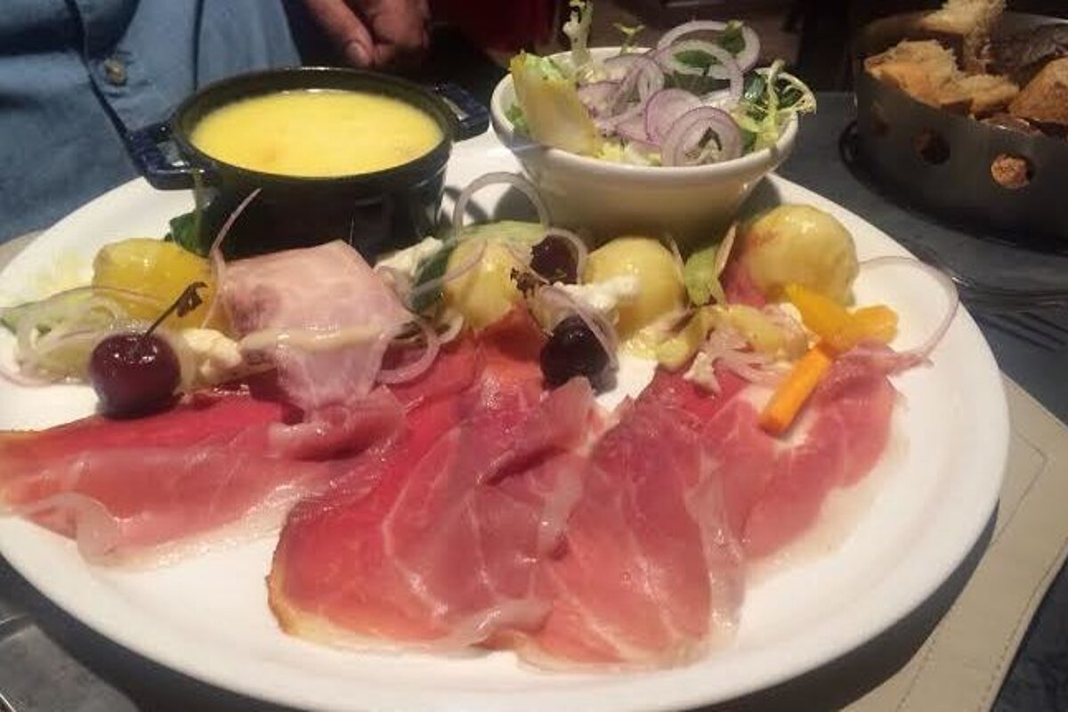 a small fondue and side dishes