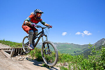 a female mountain biker on a jump