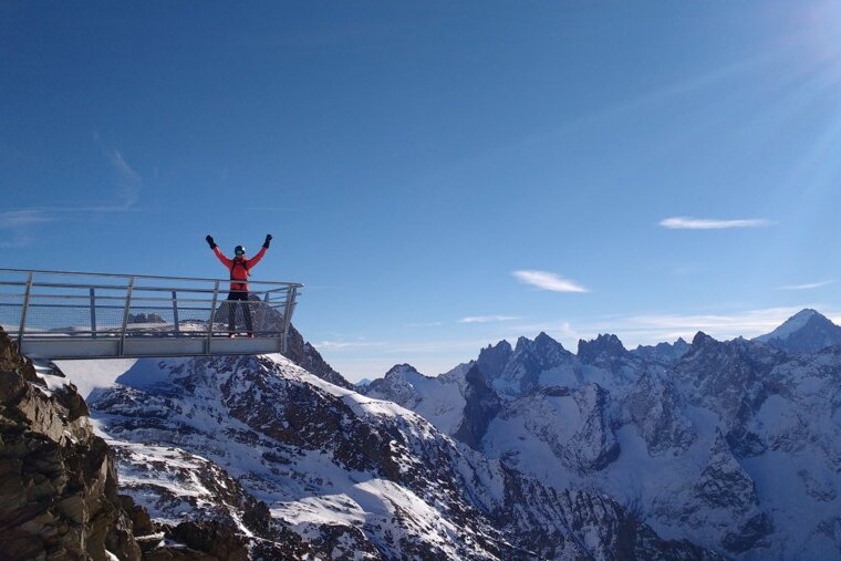 a man standing on an overhang