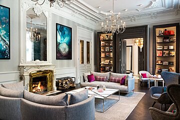 A living room filled with furniture and a fireplace