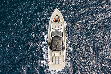 An aerial view of a boat in the ocean