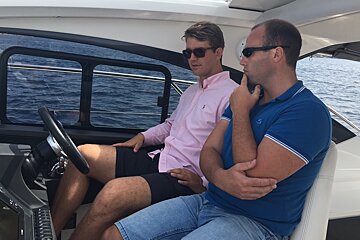 two men in a motor yacht in mallorca