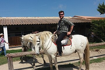 a man sitting on a horse
