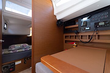 A room with a bed and a radio that says raymarine on it