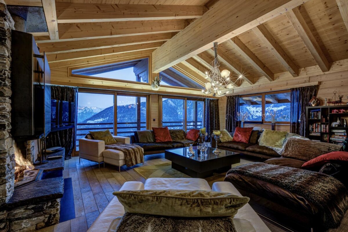 A living room with a lot of furniture and a fireplace