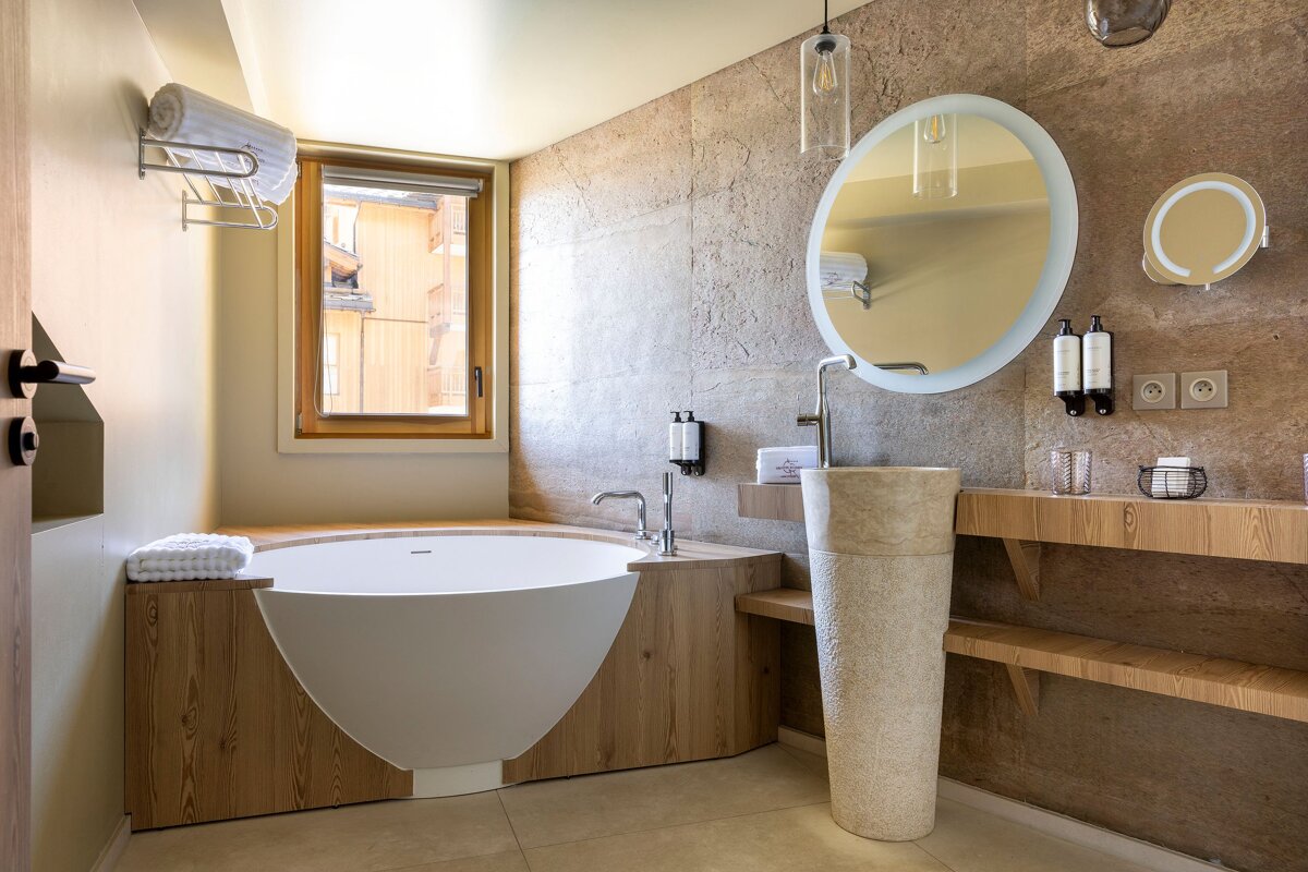 A bathroom with a bathtub and a sink