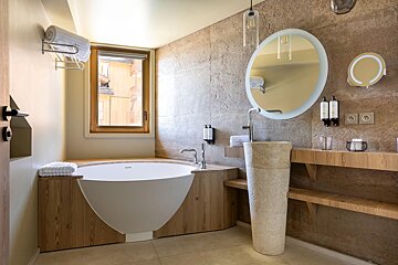 A bathroom with a bathtub and a sink
