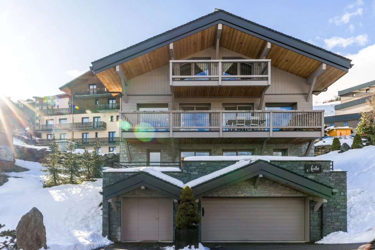 A large house with a sign that says a chalet