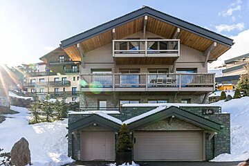A large house with a sign that says a chalet