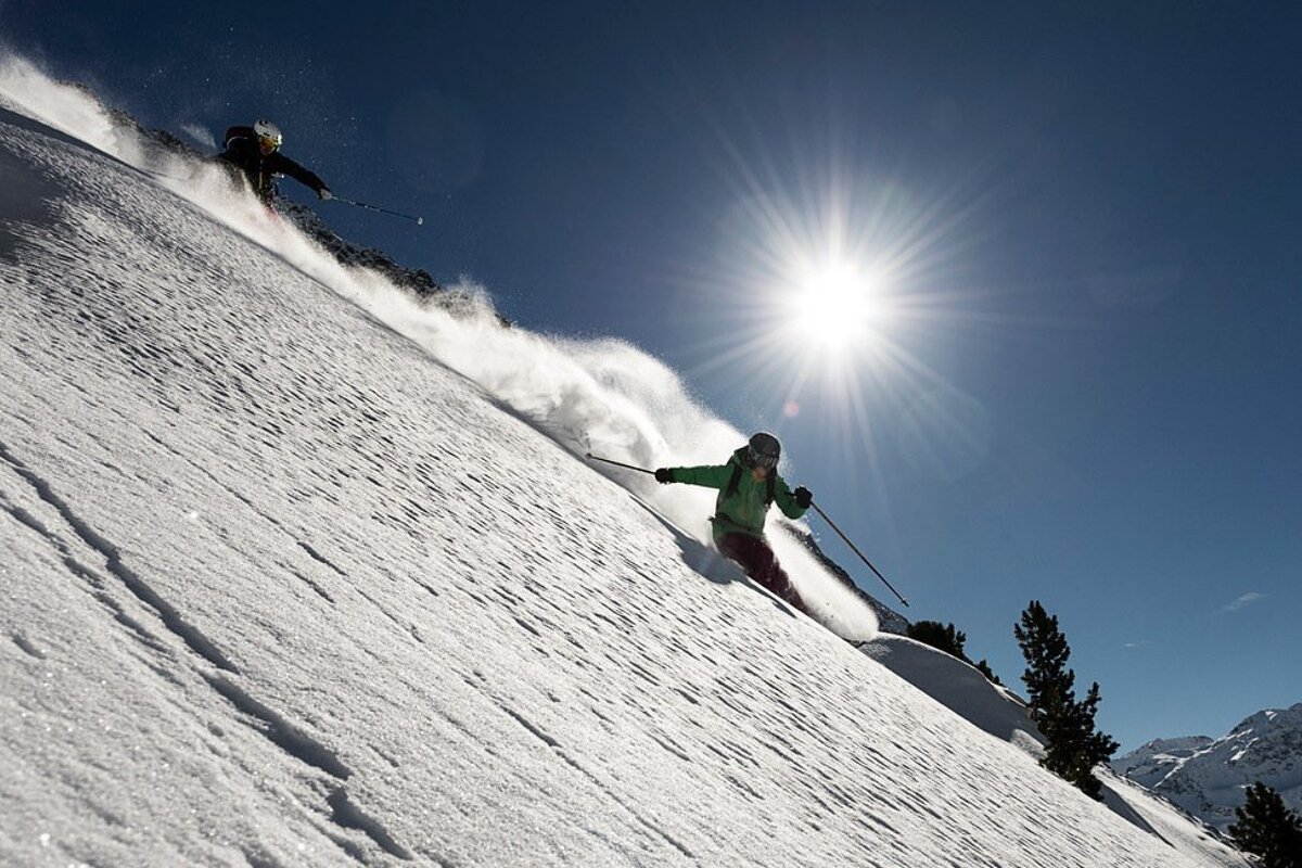 two skiers off piste
