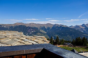 A view of a mountain range from a balcony