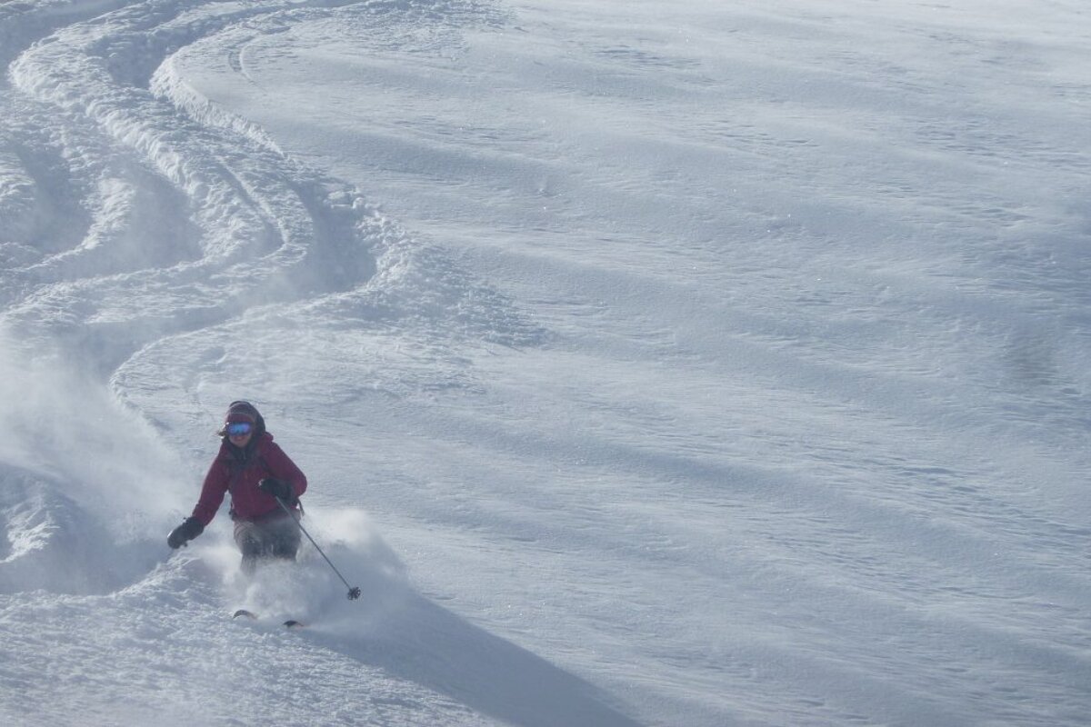 a woman in a purple jacket