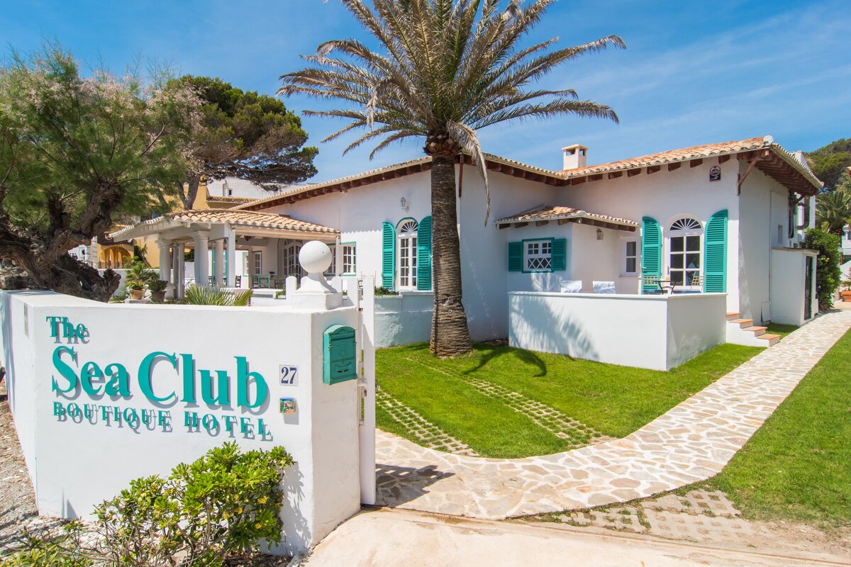 A sign for the sea club boutique hotel