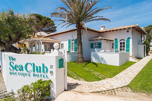 A sign for the sea club boutique hotel
