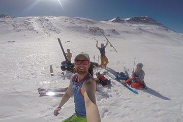 ski tourers with their tops off celebrating