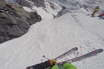 a skier about to drop into an off piste line