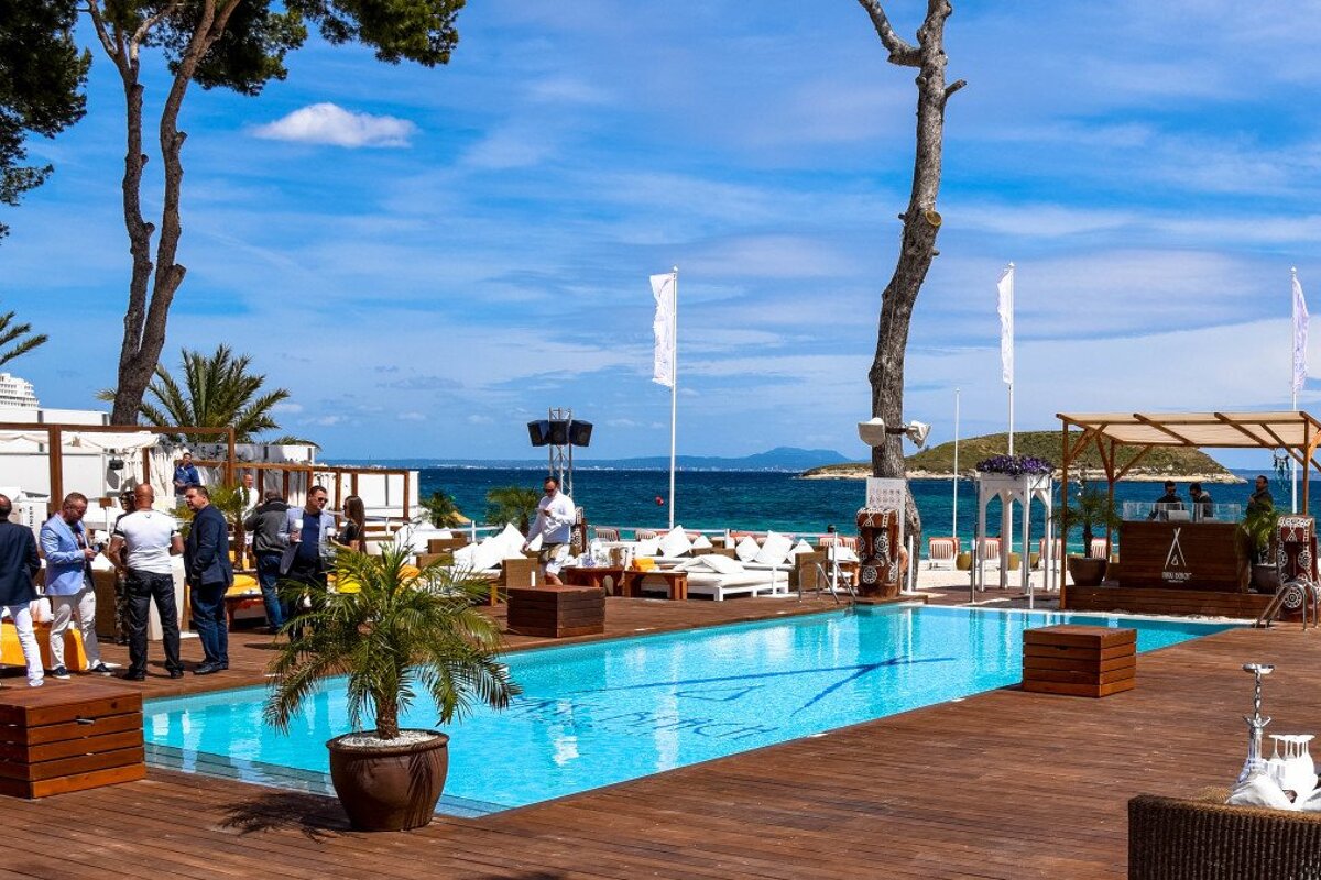 people drinking around the pool at Nikki Beach