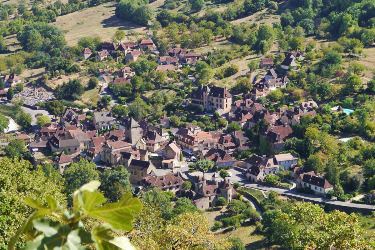 a view looking down over the town of Autoire