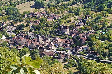 a view looking down over the town of Autoire