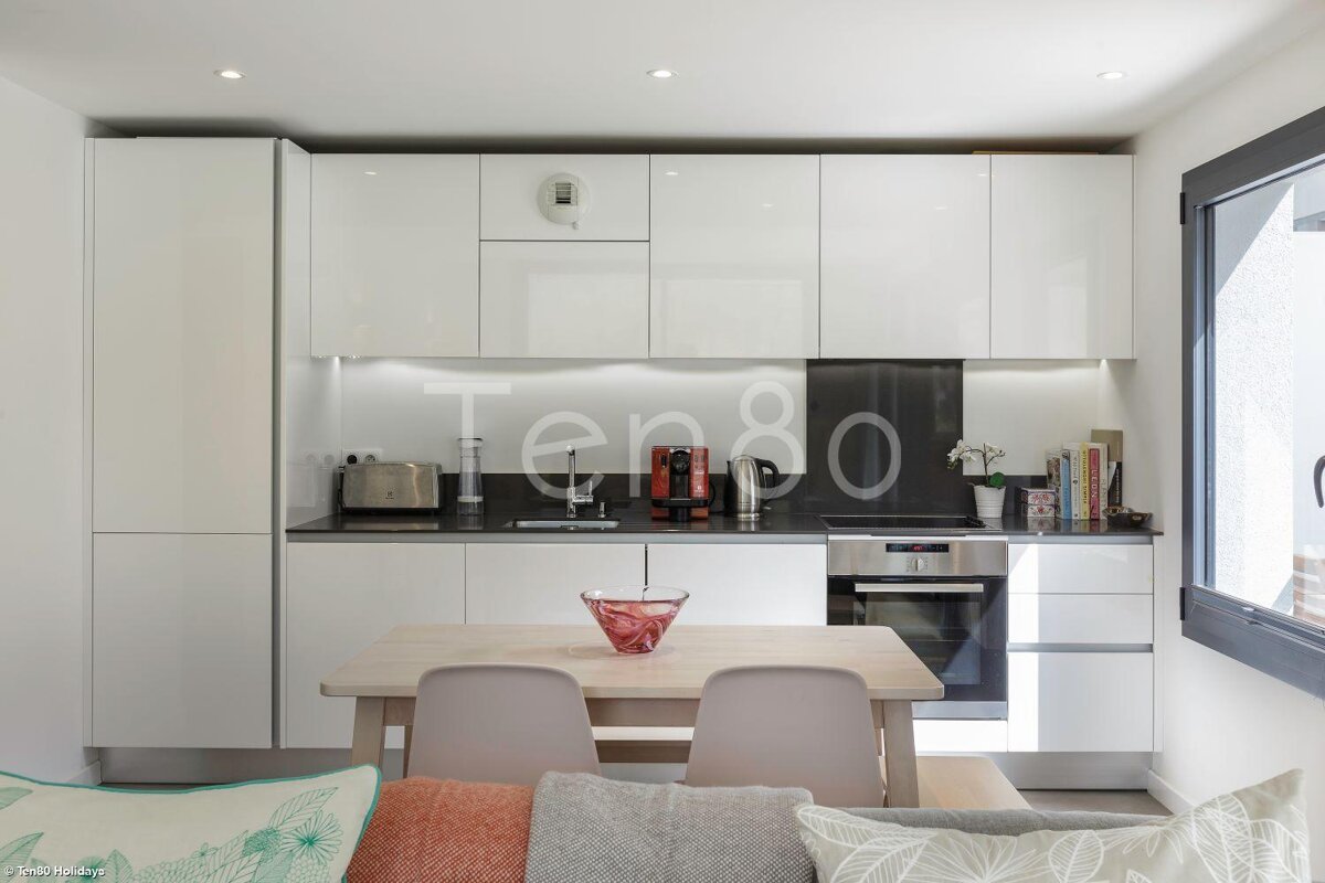 A kitchen with the word ten80 on the wall