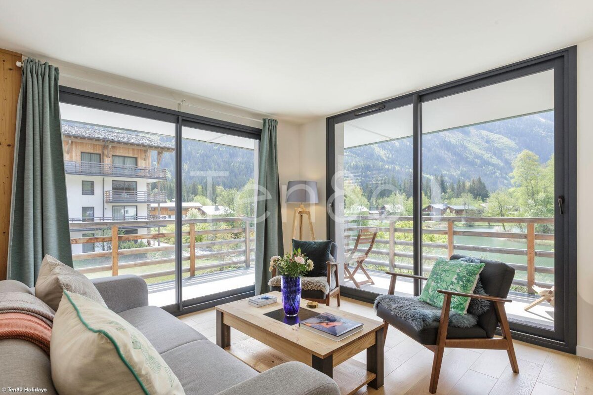 A living room with a couch a chair and a coffee table