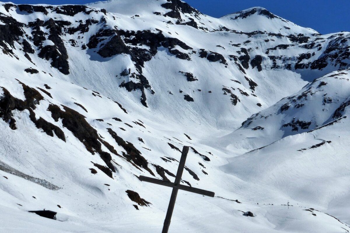 a cross on the mountain side