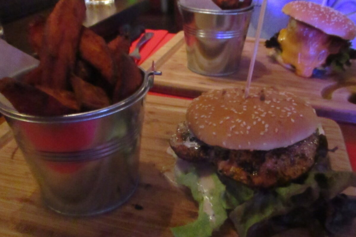 a chicken burger with sweet potato fries