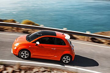 an image of red car on the coastline - fiat 500e