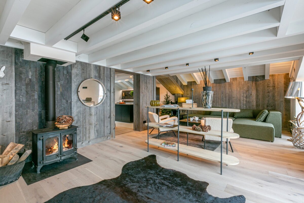 A living room with a fireplace and a rug