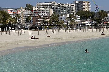 a man swimming in the sea in Mallorca