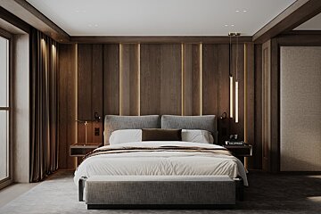 A modern, luxurious bedroom with a grey bed, dark wood-paneled accent wall featuring integrated warm lighting, and elegant pendant lamps.