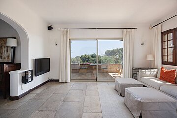 A living room with a couch and a flat screen tv