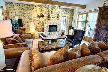 A living room filled with furniture and a fireplace