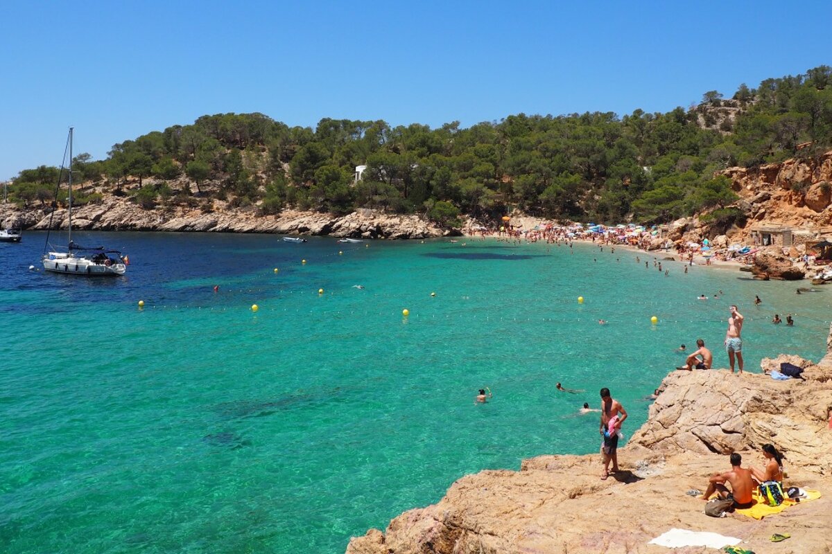 turquoise waters and rocky coastline of cala salada ibiza