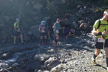 A man in a yellow shirt with the number 9311 on it