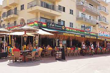 brightly coloured bar fronts in can picafort